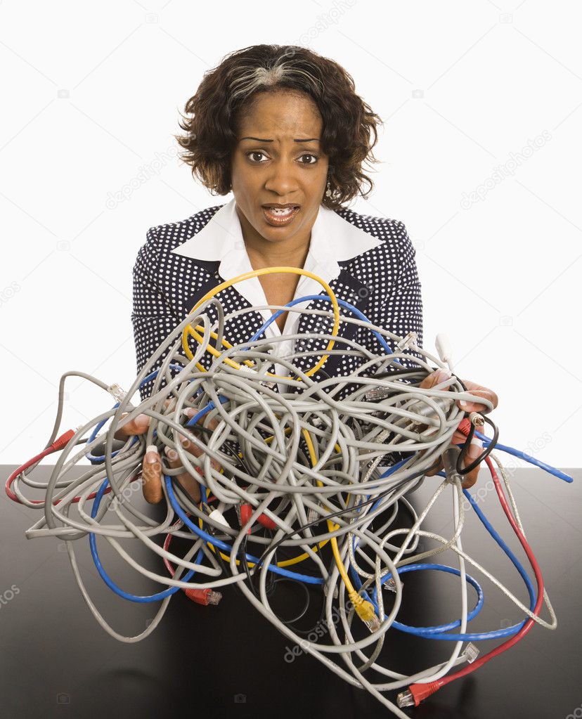Businesswoman with computer cords.