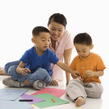 Boys coloring with mother. clipart