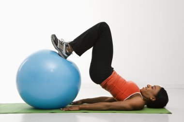 Woman exercising with ball. clipart