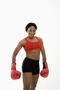 Woman wearing boxing gloves. clipart