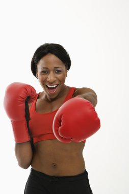 Woman boxer punching. clipart