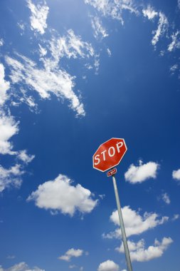 Stop sign in sky. clipart