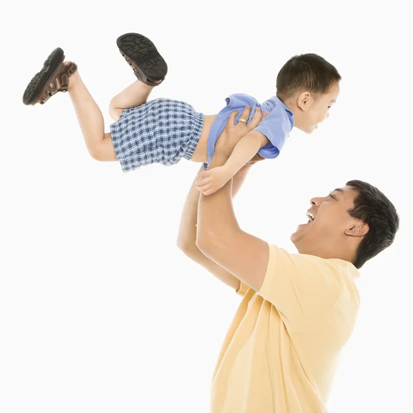 stock image Father lifting son.