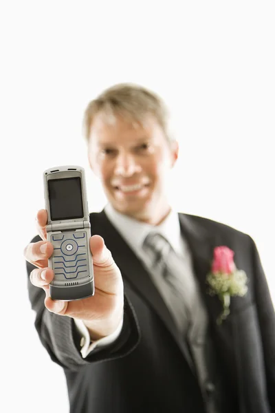 Vőlegény gazdaság cellphone. — Stock Fotó