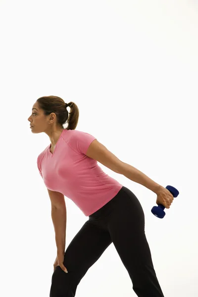 Woman exercising with dumbbell. — Stock Photo, Image