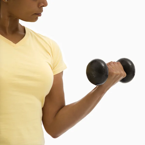 Woman exercising with dumbbell. — Stock Photo, Image