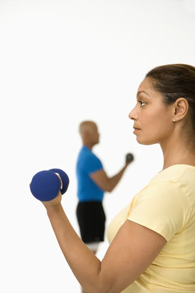 Woman exercising with dumbbell. — Stock Photo, Image