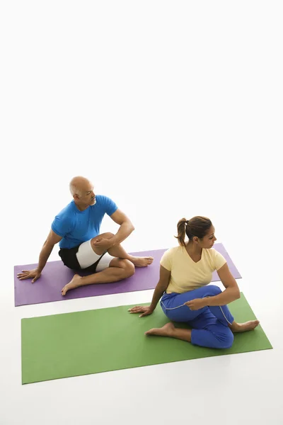Man and woman stretching. — Stock Photo, Image