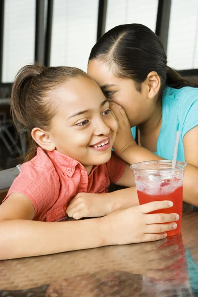 Young Girl Whispering to Another — Stock Photo, Image