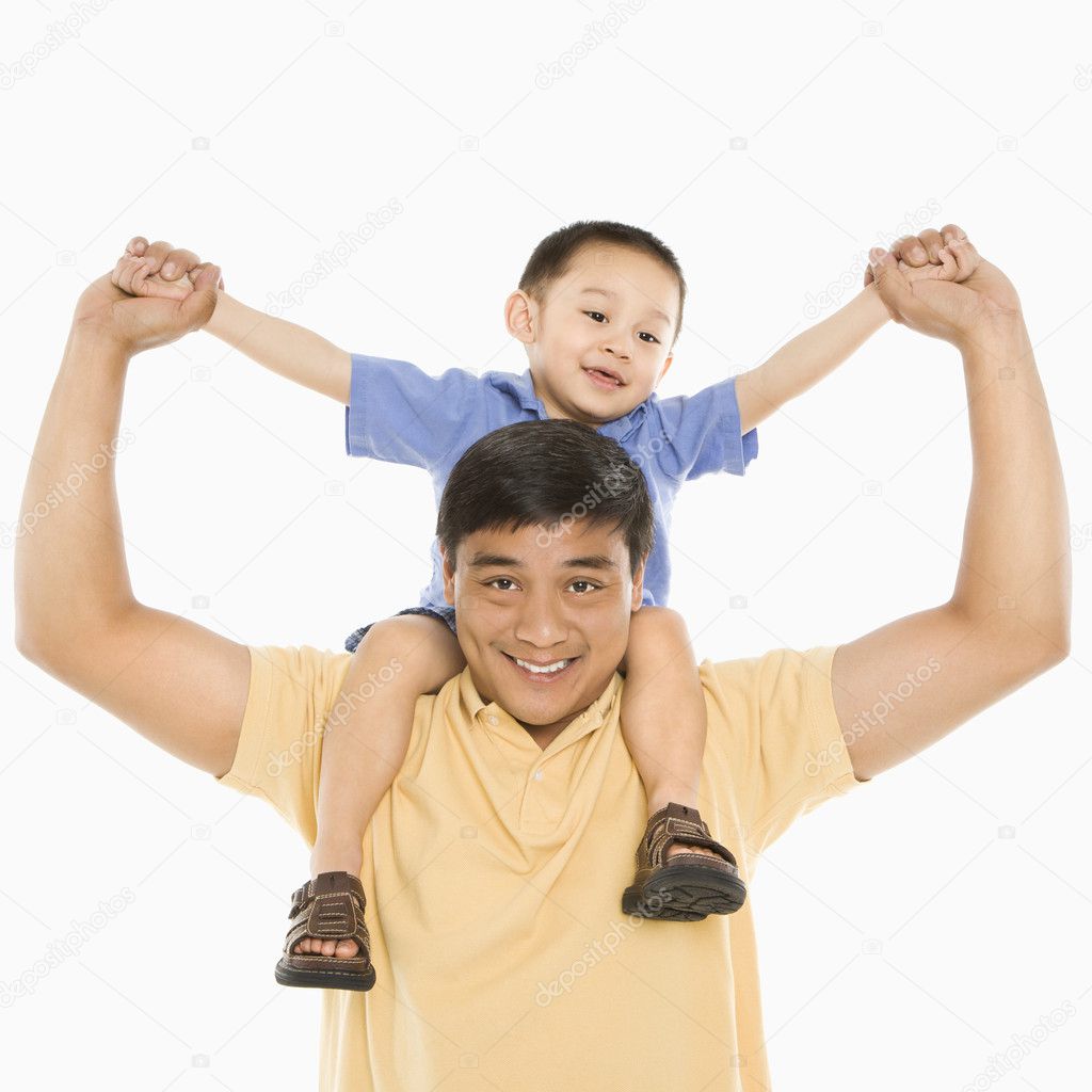 Father holding boy.