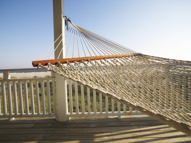 Hammock on porch. clipart