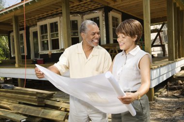 Couple Holding Building Plans clipart