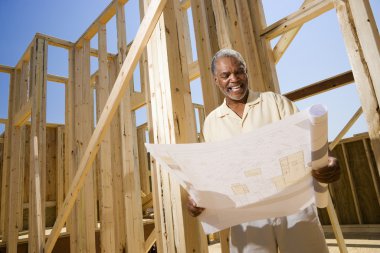 Man Holding Building Plans clipart