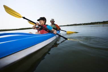 Couple kayaking. clipart