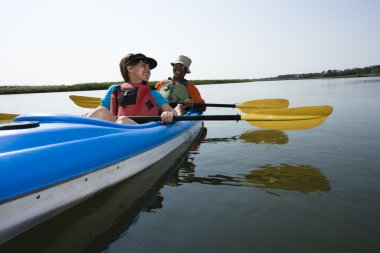 Couple kayaking. clipart