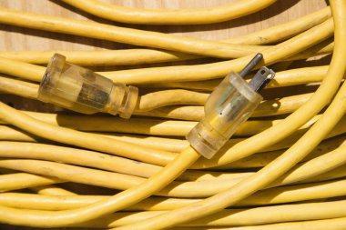 Yellow extension cord. clipart