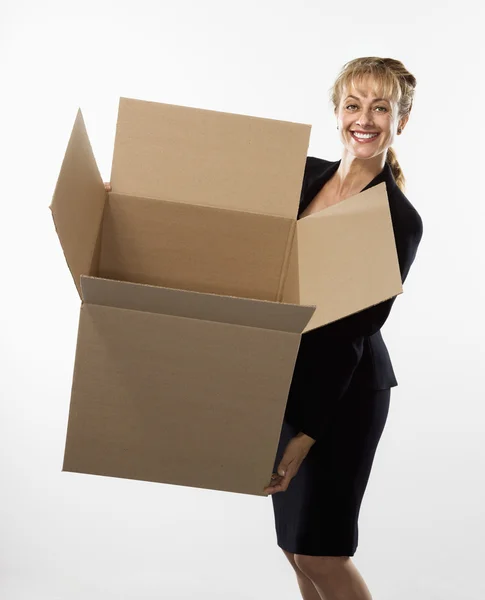 stock image Woman holding box.