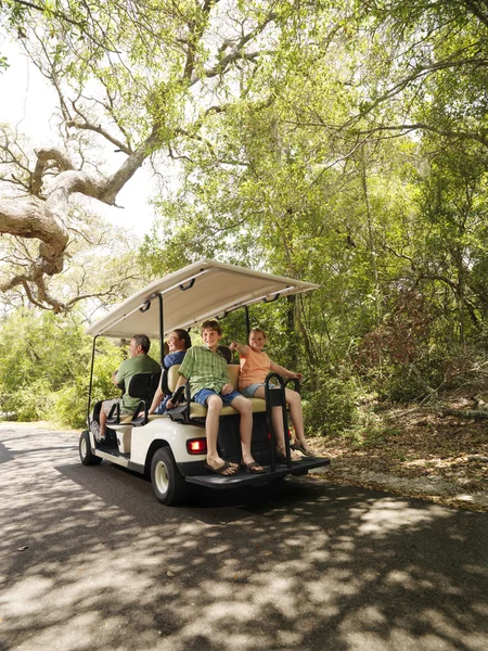 Family in golf cart. — Stock Photo, Image