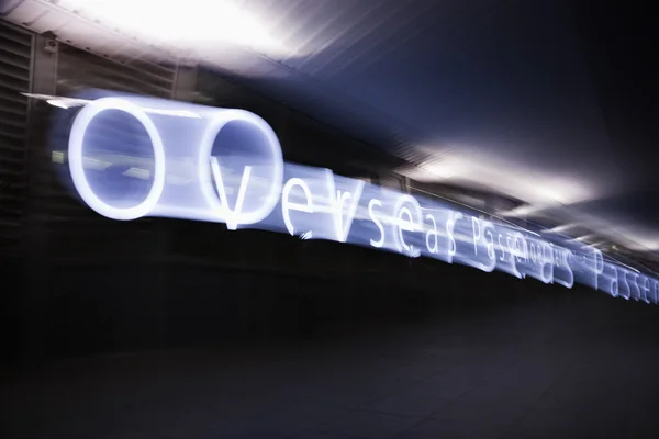 Blurred Overseas terminal sign. — Stock Photo, Image