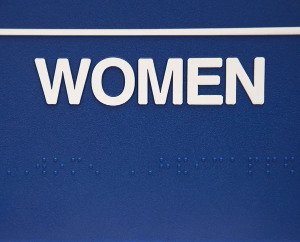 Znak kobiet z Braille'a. — Zdjęcie stockowe