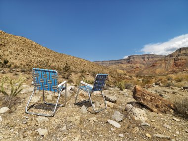 Chairs facing landscape. clipart