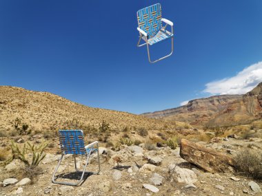 Chairs in desert. clipart