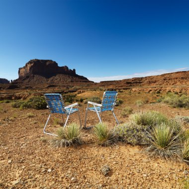 Chairs in desert. clipart