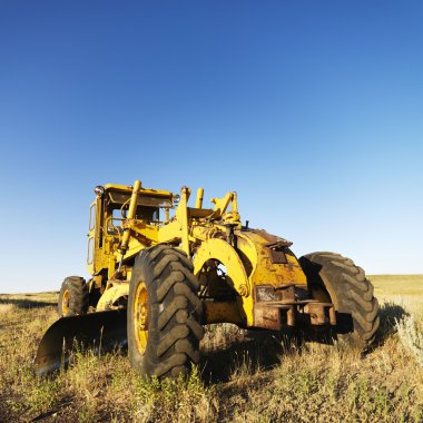 Tractor in field. clipart