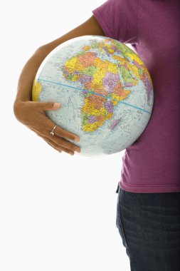 Woman holding world. clipart