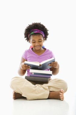 Girl reading books. clipart