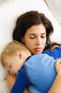 Mom and child sleeping. clipart