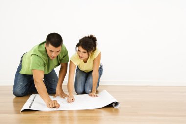 Couple with house plans. clipart