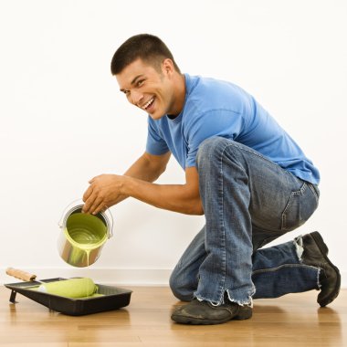 Man pouring paint. clipart