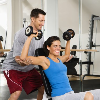 Woman lifting weights clipart