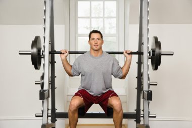 Man lifting weights clipart