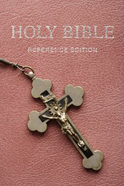 Holy Bible and crucifix. clipart