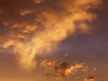 Orange clouds in sky. clipart