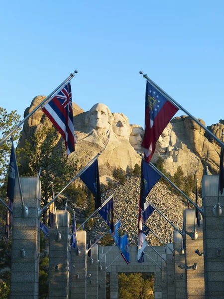 Mount Rushmore with flags. — Stock Photo, Image