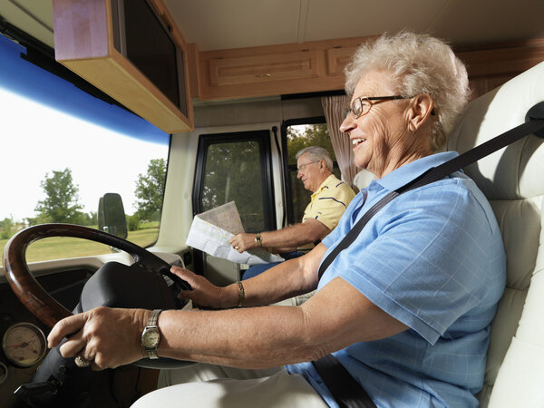 Senior woman driving RV.