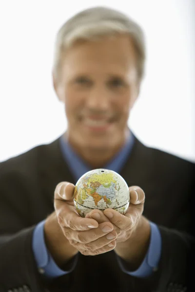 Businessman holding world. — Stock Photo, Image