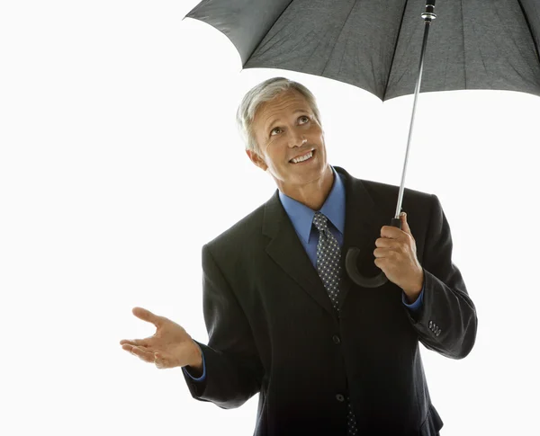 Geschäftsmann mit Regenschirm. — Stockfoto