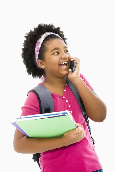 Schoolmeisje met telefoon. — Stockfoto