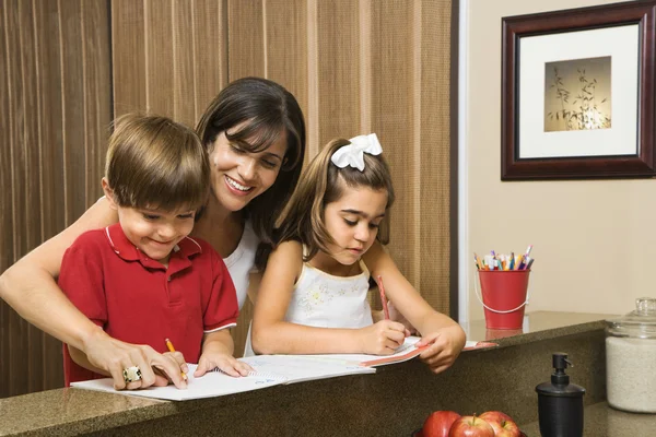 Family doing homework. — Stock Photo, Image
