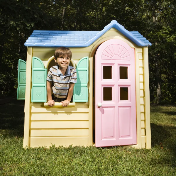 Boy in playhouse. — Stock Photo, Image
