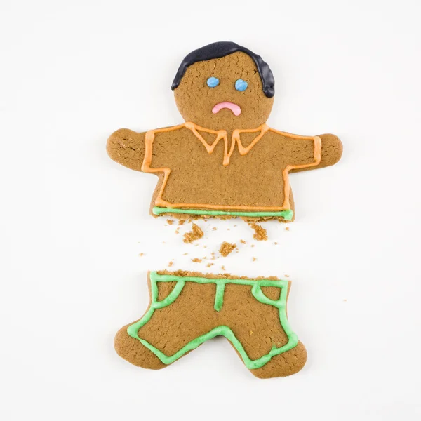Broken gingerbread man. — Stock fotografie
