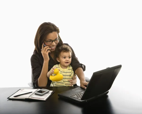 Businesswoman and baby. Royalty Free Stock Images