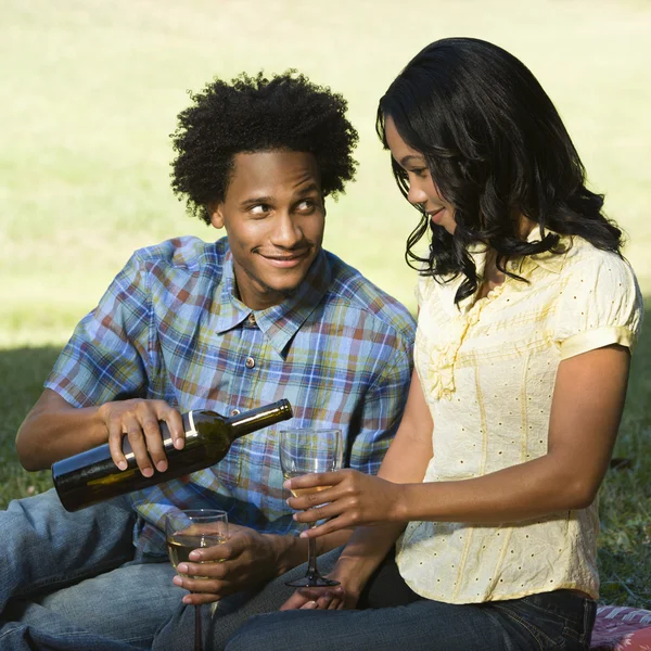 Man pouring woman wine. — Stock Photo, Image