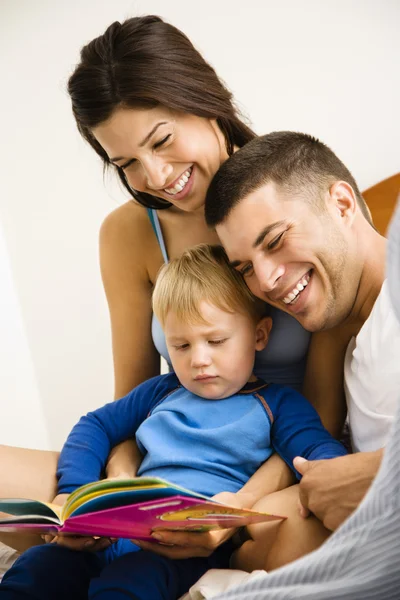 Family reading book. — Stock Photo, Image