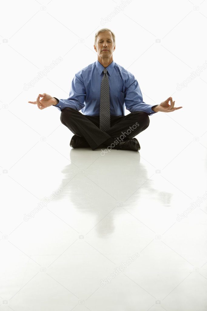 Businessman meditating.