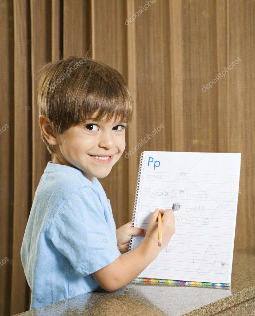 Boy showing homework.
